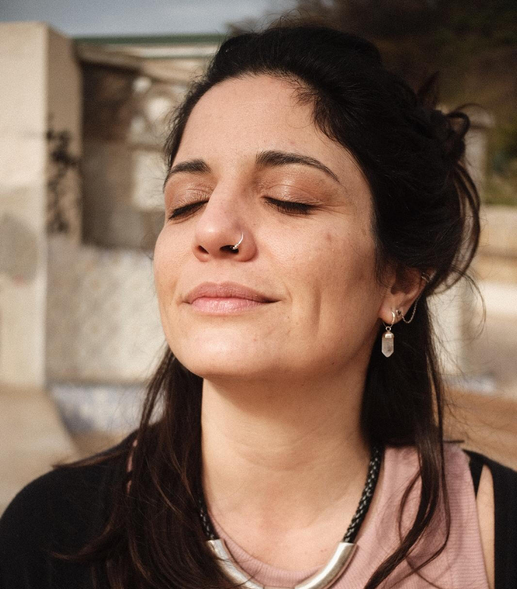 Your truth resides within Flor, founder of Espacio Medrar, with eyes closed in a moment of inner peace and connection – embodying the idea that your truth resides within – Akashic Records session